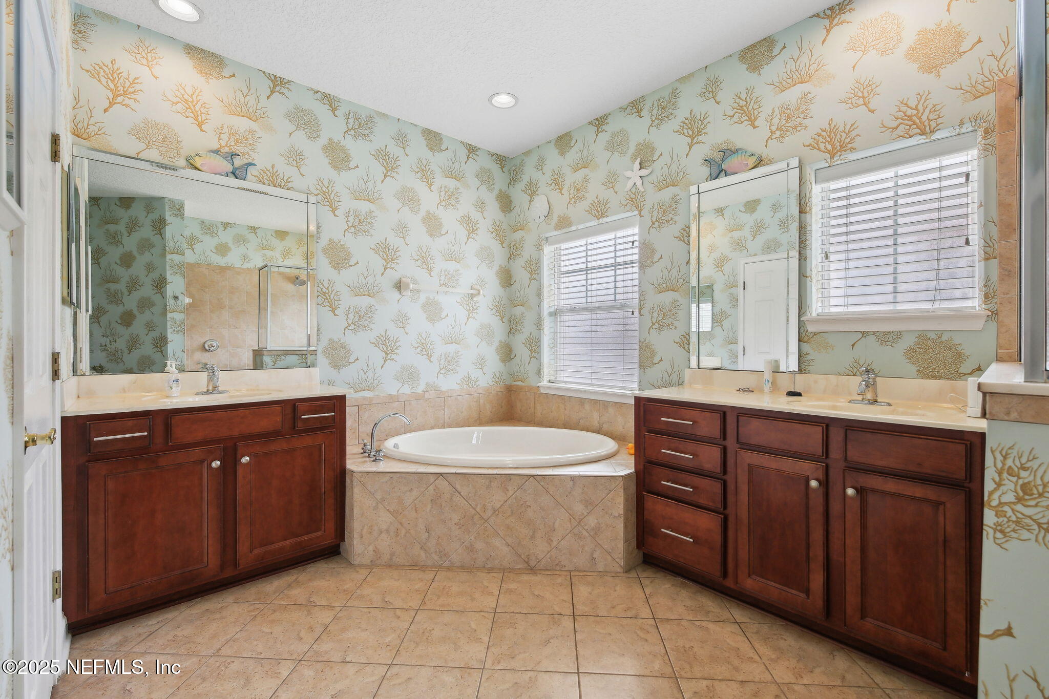400 Central Street St. Augustine, FL 32095 - Photo 36 of 49 a spacious bathroom with a sink mirror and a bathtub