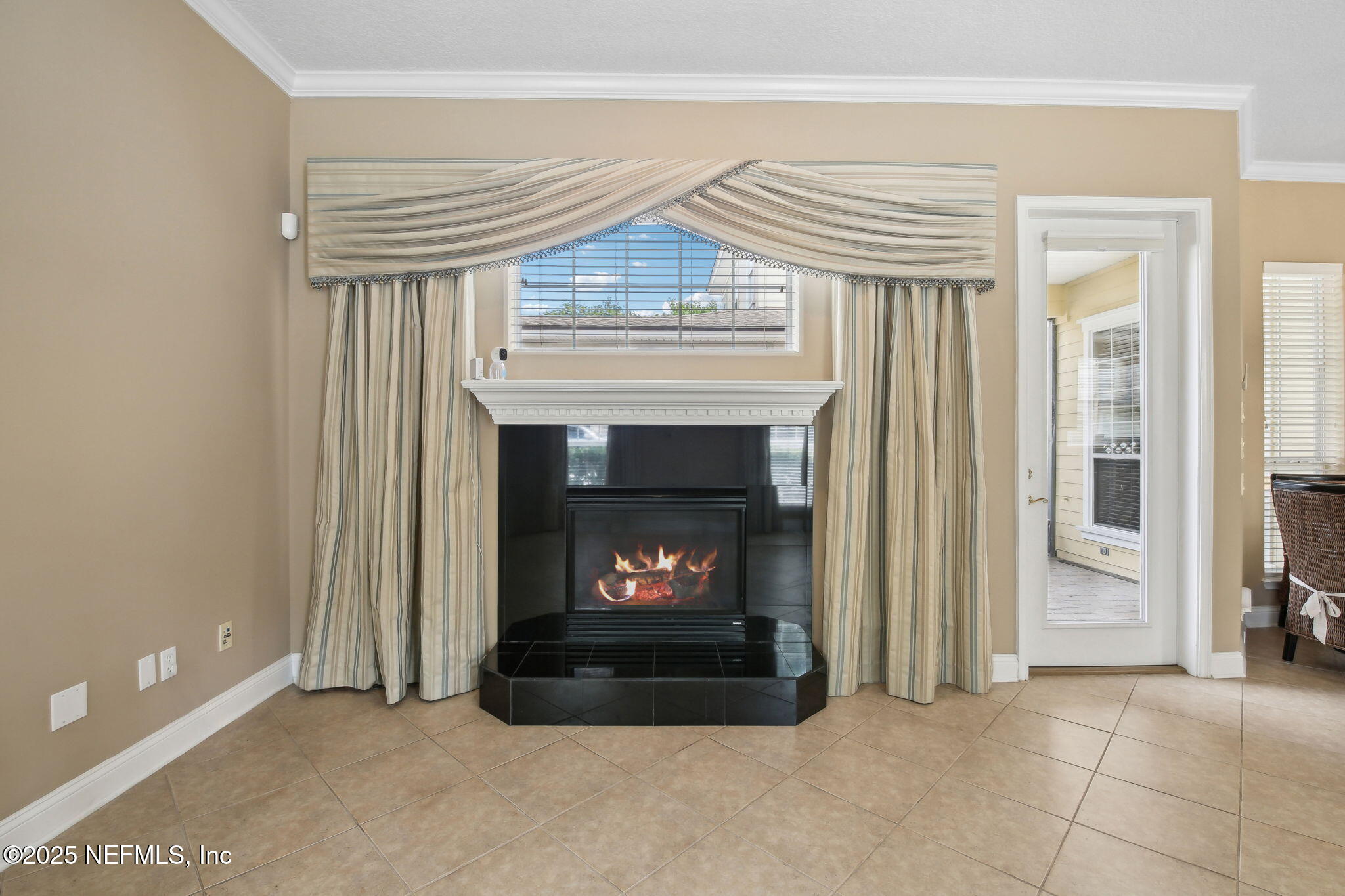 400 Central Street St. Augustine, FL 32095 - Photo 10 of 49 a living room with a fireplace in it and a fireplace