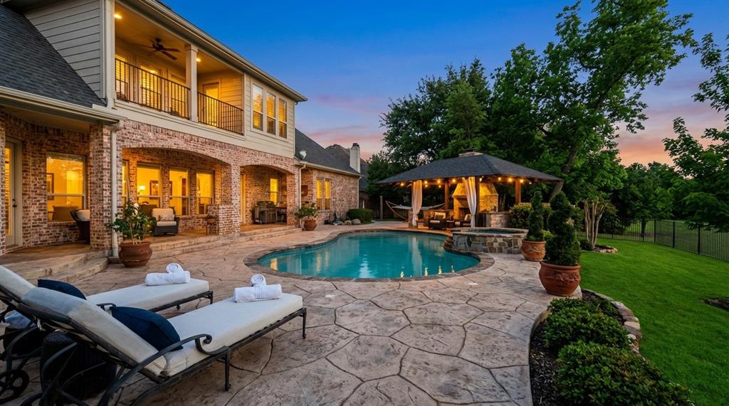 1919 Kings Pass Heath, TX 75032 - Photo 36 of 38 Integrated pool / spa featuring a patio area, a balcony, and a fenced backyard