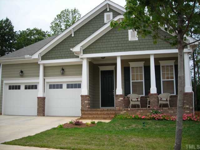 1116 Chapanoke Road, Unit 1072 Raleigh, NC 27603 - Photo 1 of 1 a front view of a house with a yard and potted plants