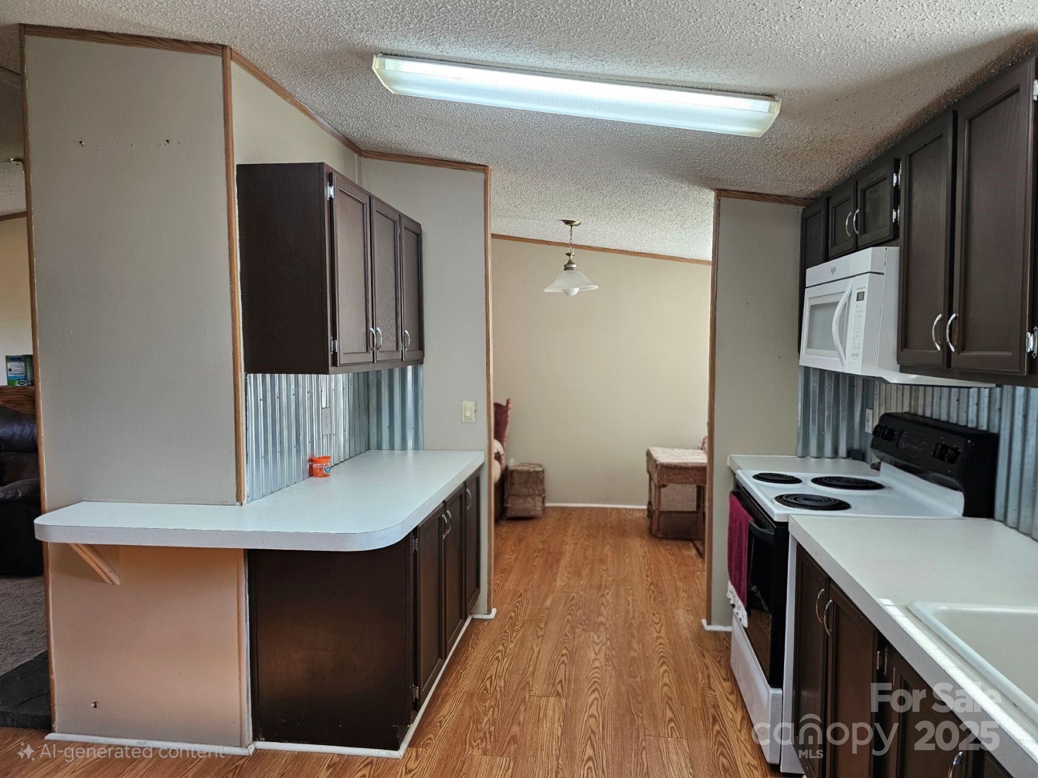 434 Howard Lingerfelt Road Vale, NC 28168 - Photo 3 of 13 a kitchen with a sink a stove and a refrigerator