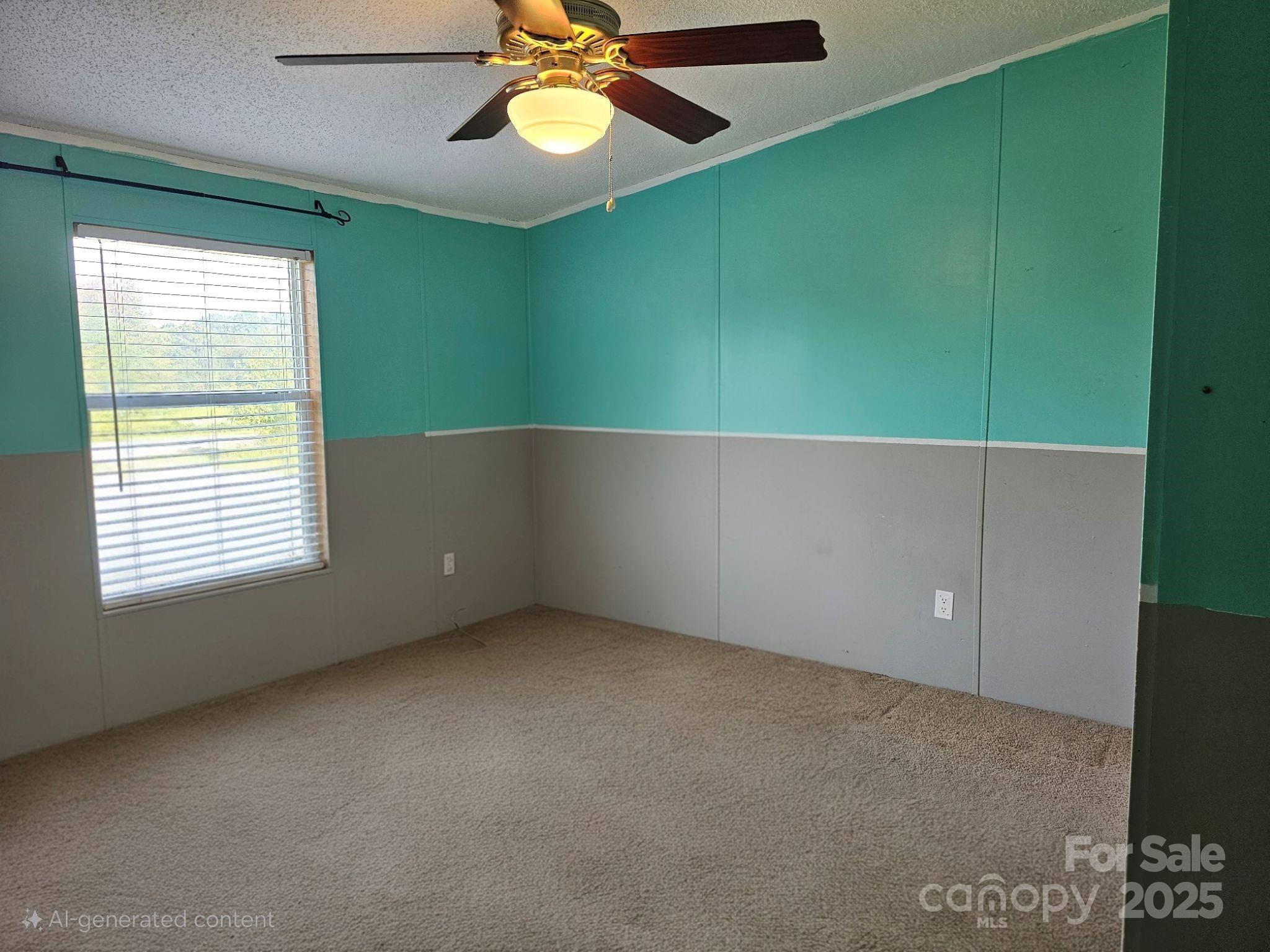 434 Howard Lingerfelt Road Vale, NC 28168 - Photo 9 of 13 a view of an empty room with a window and a ceiling fan