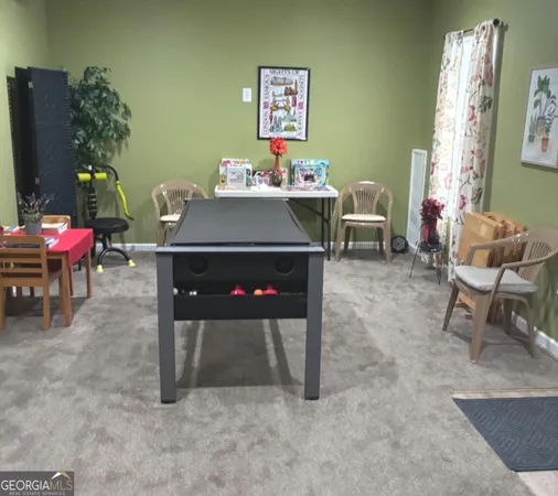a living room with furniture a window and a table