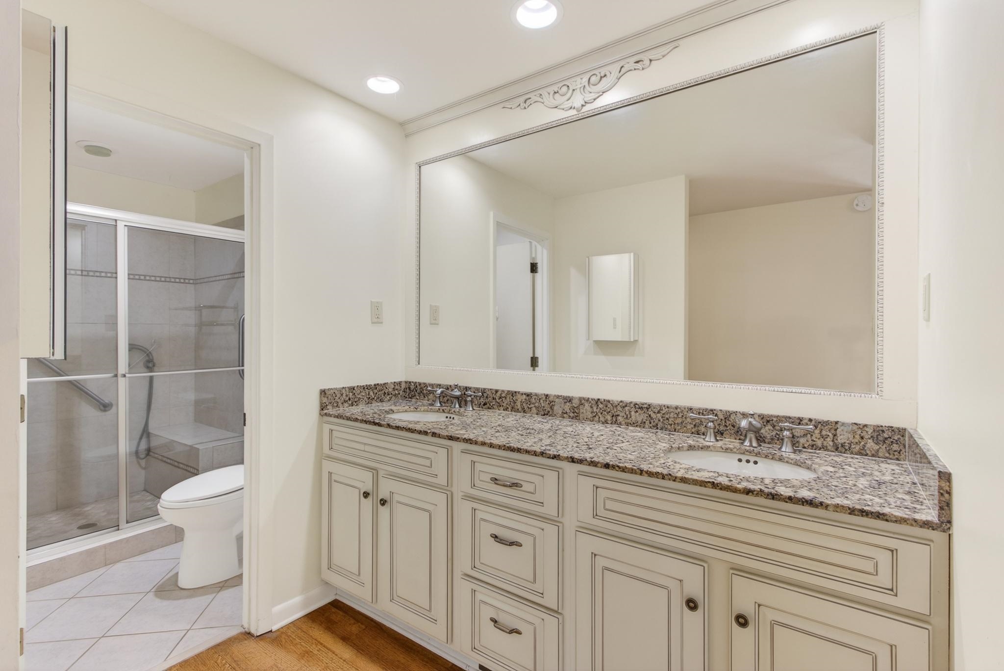 3121 Beechrun Drive Memphis, TN 38128 - Photo 24 of 40 The clean and comfortable design in the primary bathroom includes a raised double vanity with granite top - providing ample space for daily routines.
