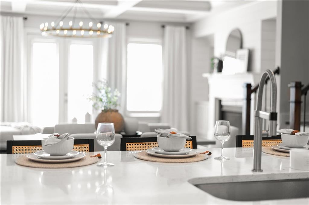 1868 Skyfall Circle Atlanta, GA 30319 - Photo 14 of 61 a kitchen with a chandelier and living room