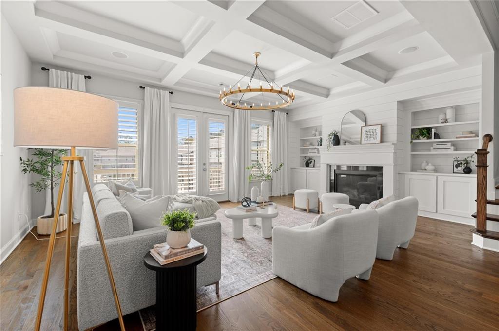 1868 Skyfall Circle Atlanta, GA 30319 - Photo 19 of 61 a living room with furniture fireplace and a chandelier