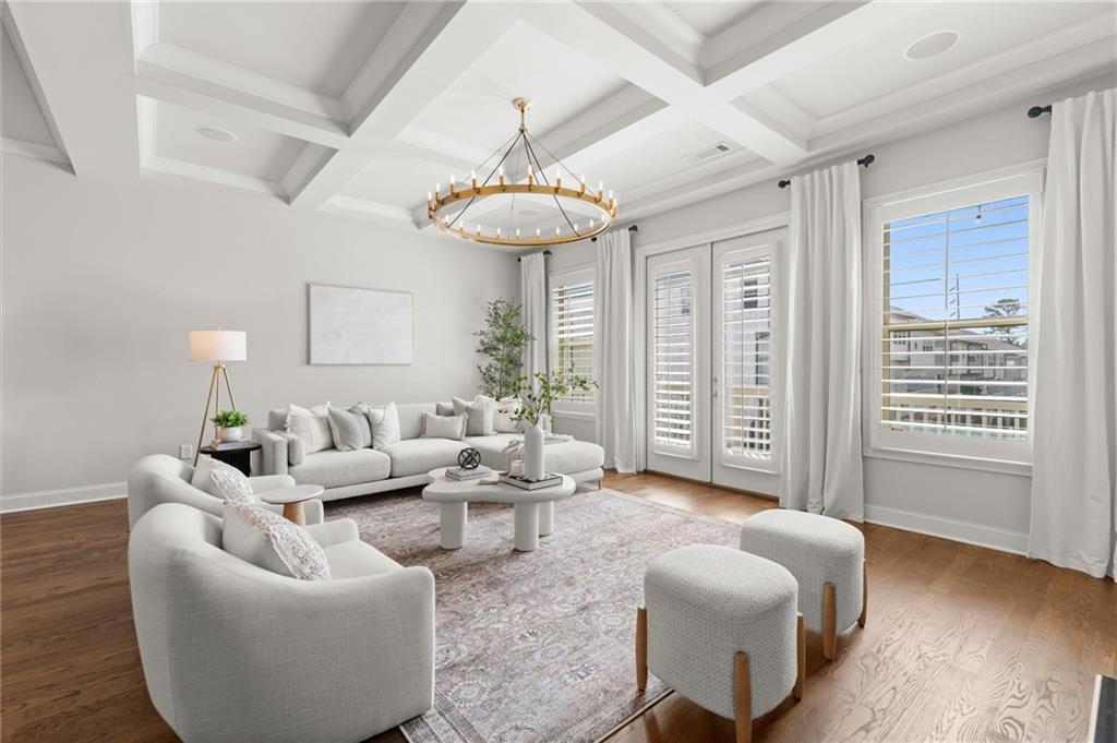 1868 Skyfall Circle Atlanta, GA 30319 - Photo 21 of 61 a living room with furniture and a chandelier
