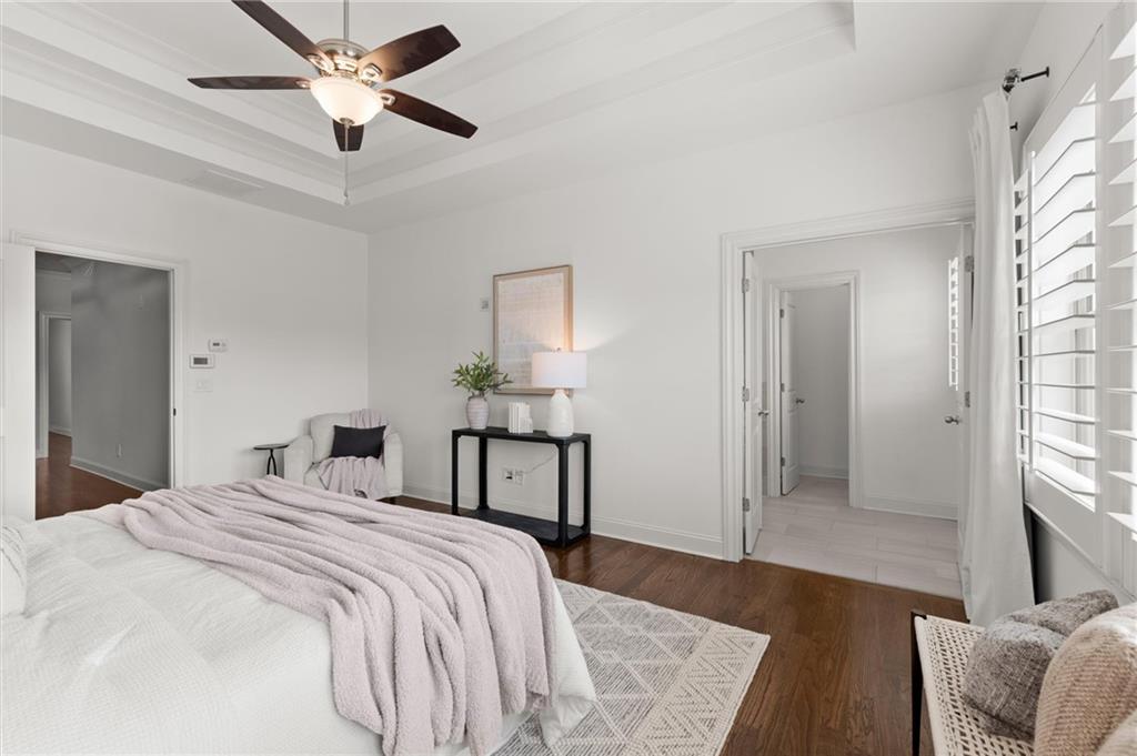 1868 Skyfall Circle Atlanta, GA 30319 - Photo 35 of 61 a bedroom with a bed and a chandelier