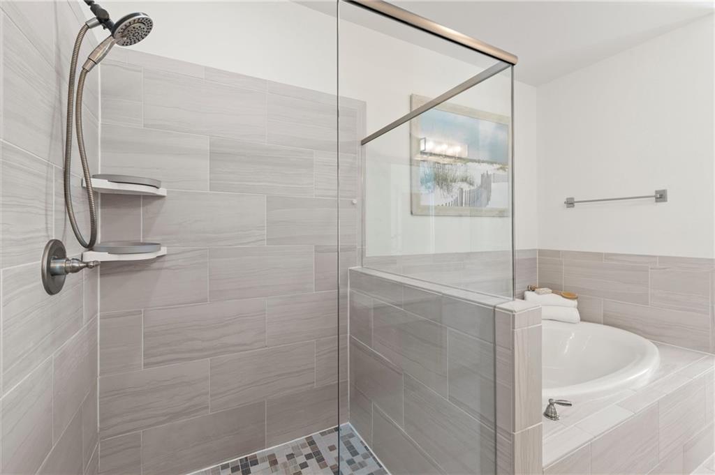 1868 Skyfall Circle Atlanta, GA 30319 - Photo 39 of 61 a bathroom with a shower and a sink