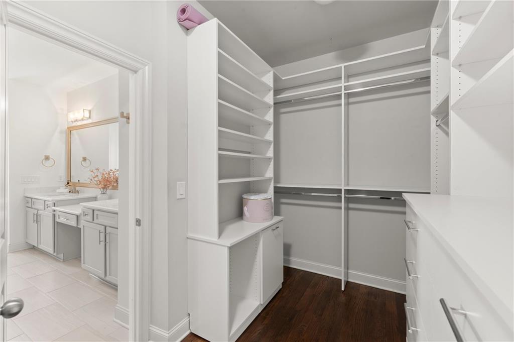 1868 Skyfall Circle Atlanta, GA 30319 - Photo 41 of 61 a view of walk in closet and bedroom view