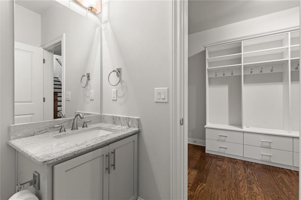 1868 Skyfall Circle Atlanta, GA 30319 - Photo 48 of 61 a bathroom with a granite countertop sink and a mirror