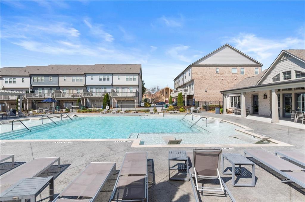 1868 Skyfall Circle Atlanta, GA 30319 - Photo 55 of 61 a view of a house with backyard porch and sitting area