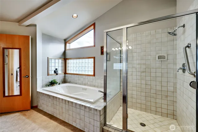 a bathroom with a bathtub and shower