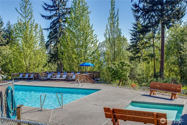 a view of a backyard with sitting area
