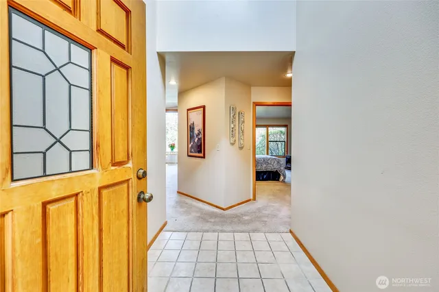 view of a bathroom with wooden floor and a window