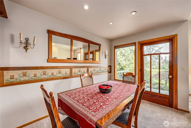 a outdoor dining room with furniture and window