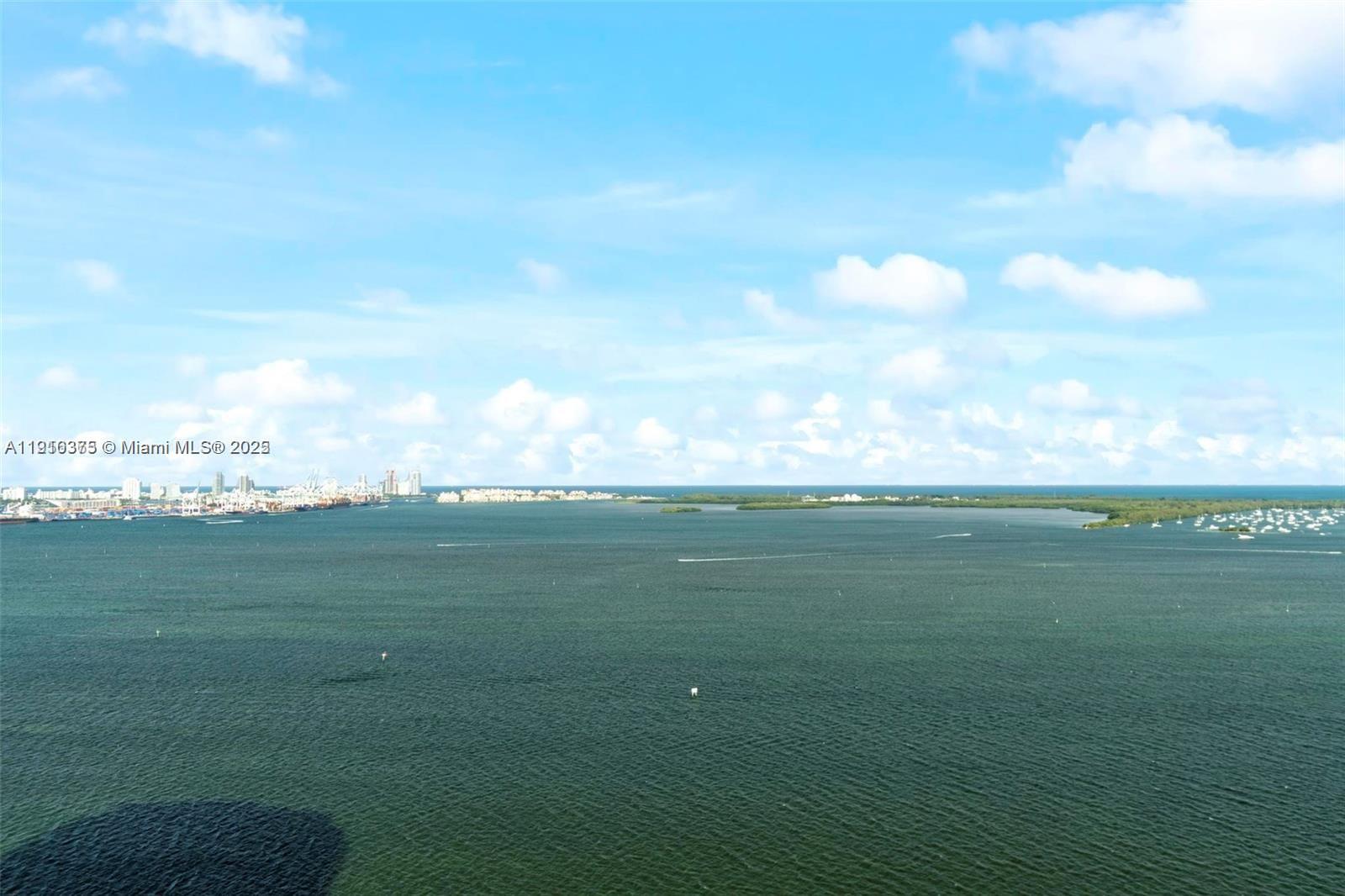 218 Southeast 14th Street, Unit 1003 Miami, FL 33131 - Photo 20 of 27 a view of an ocean and beach