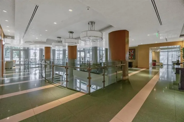 a spacious bedroom with a large bed and a large window