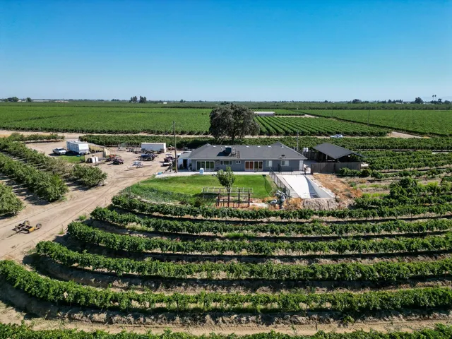 an aerial view of a house with a garden