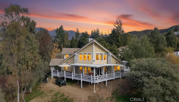 a view of a house with a yard from a balcony