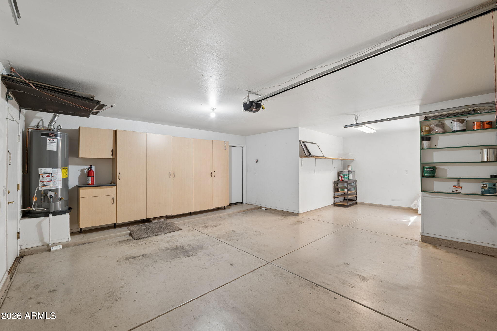 4418 East Jaeger Road Phoenix, AZ 85050 - Photo 33 of 42 31 - Garage with built in cabinets and s