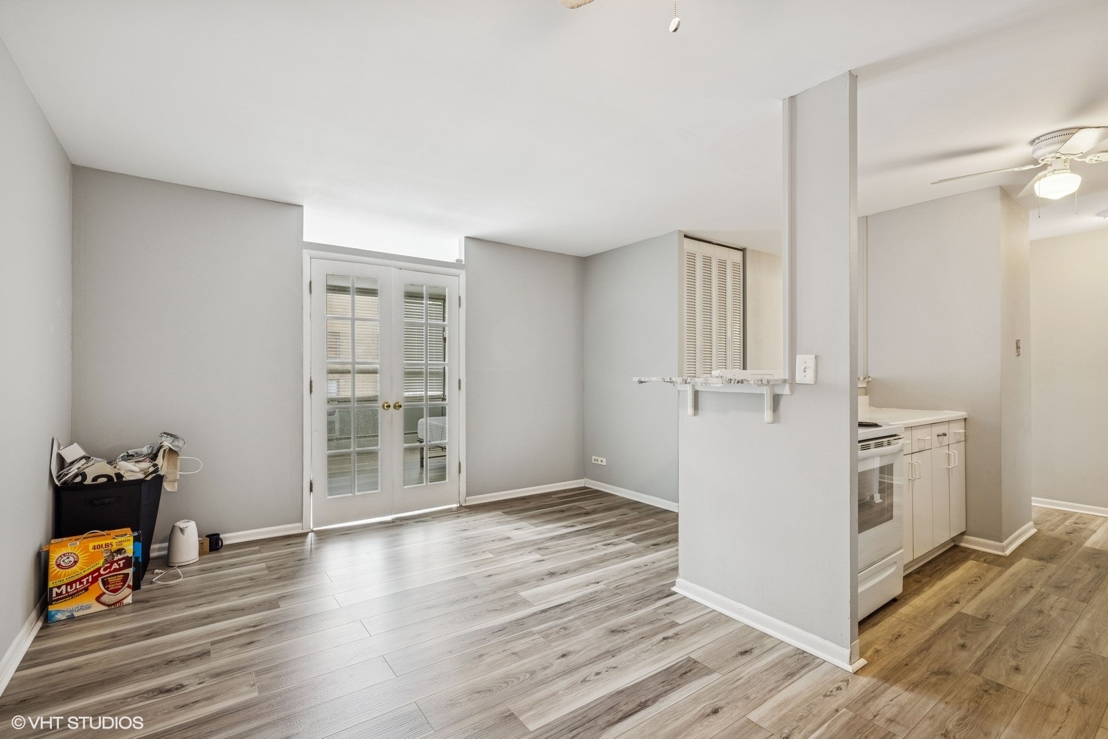 6171 North Sheridan Road, Unit 2404 Chicago, IL 60660 - Photo 17 of 30 an empty room with wooden floor and cabinet