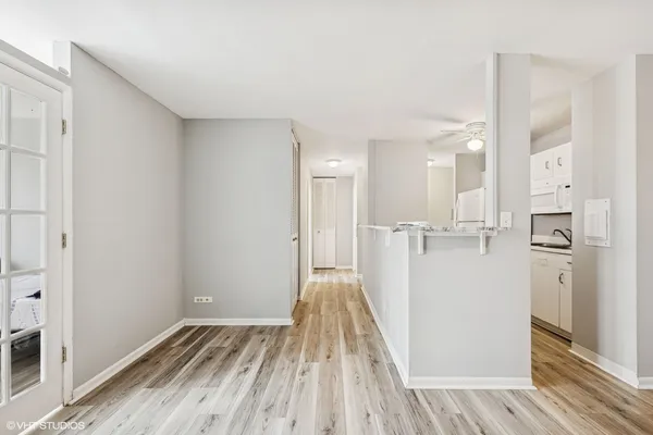 a view of a kitchen from the hallway