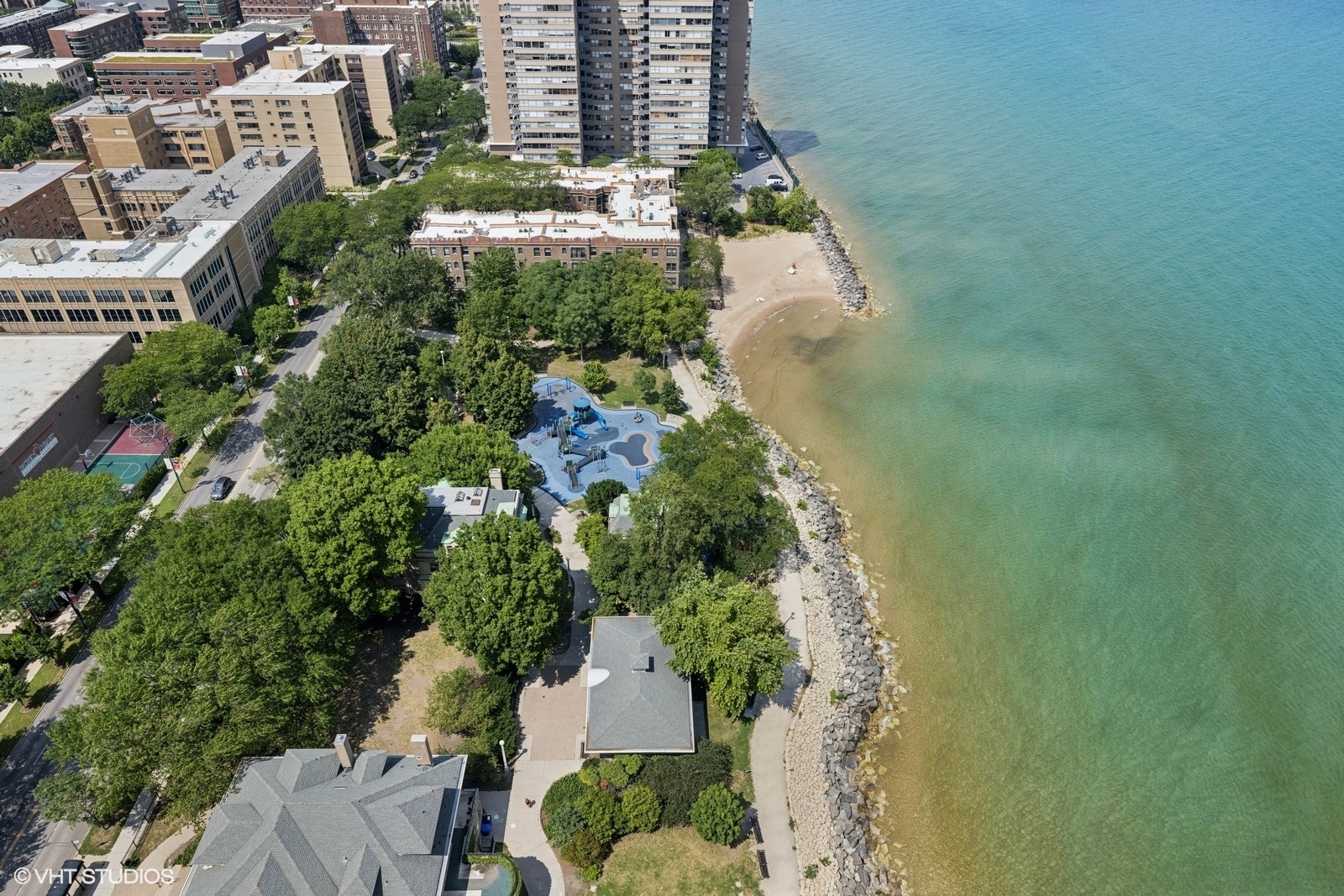 6171 North Sheridan Road, Unit 2404 Chicago, IL 60660 - Photo 3 of 30 an aerial view of a residential apartment building with a yard