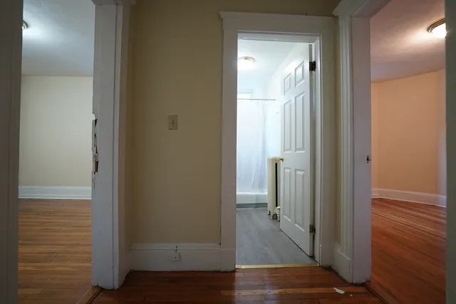 a view of a bathroom from a hallway