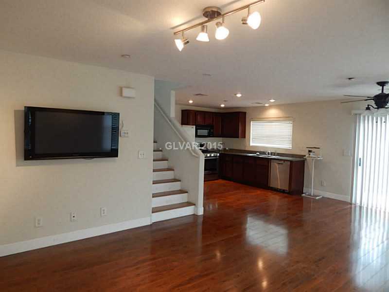 1165 Paradise River Road Henderson, NV 89002 - Photo 26 of 35 Property Photo. Living room to kitchen.