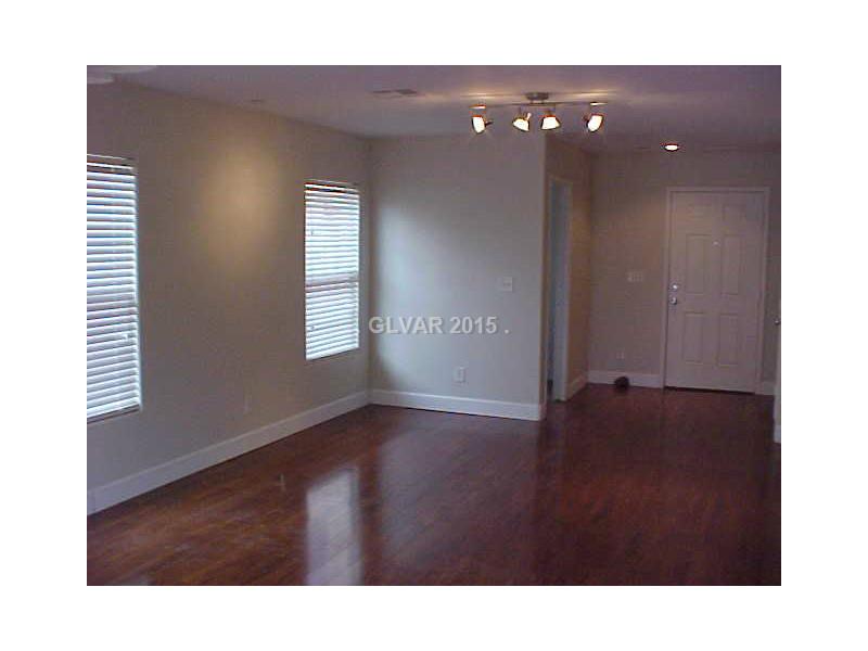 1165 Paradise River Road Henderson, NV 89002 - Photo 5 of 35 Property Photo. Living/dining area. Wide baseboards.