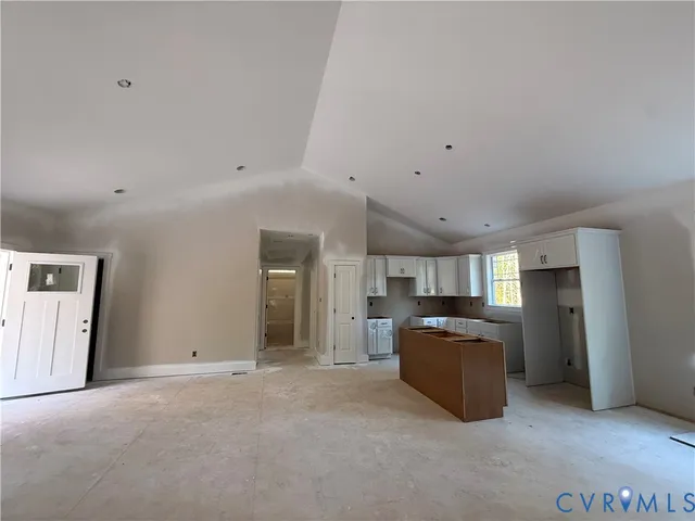 a view of kitchen and refrigerator