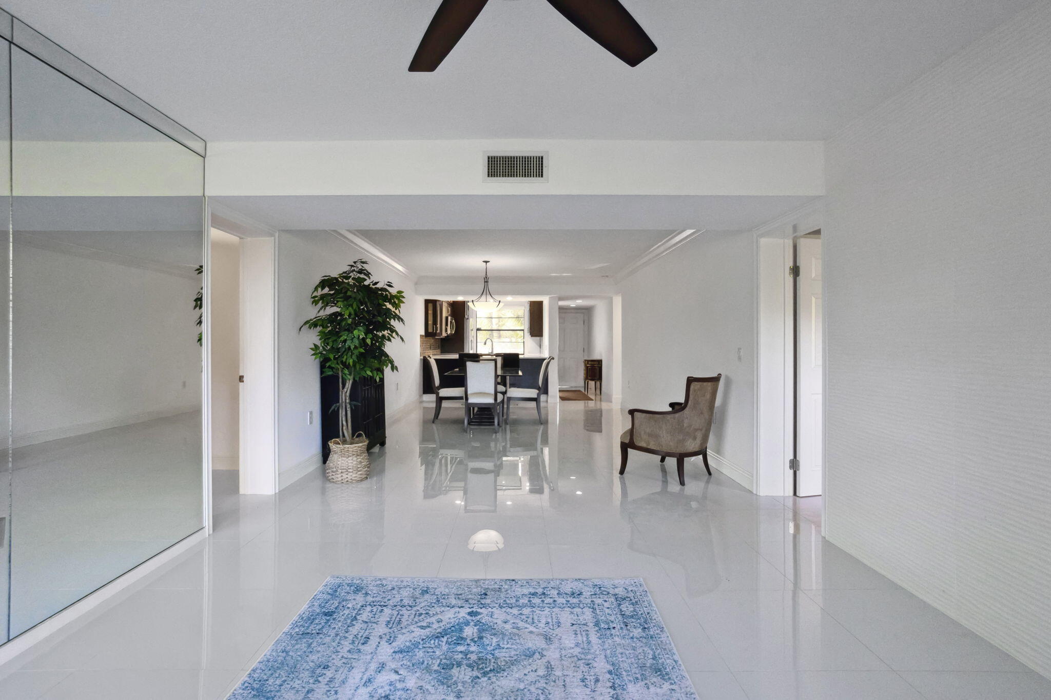6073 Balboa Circle, Unit 201 Boca Raton, FL 33433 - Photo 11 of 40 Living room to Kitchen