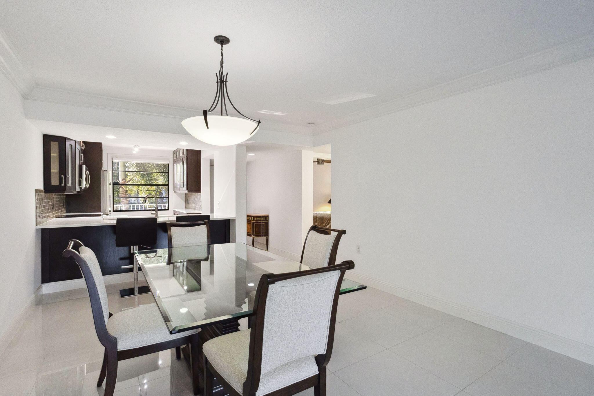 6073 Balboa Circle, Unit 201 Boca Raton, FL 33433 - Photo 3 of 40 Dining to Kitchen