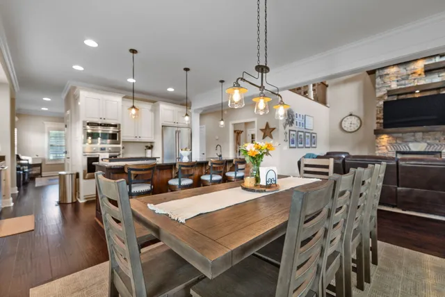 a living room with furniture and a ceiling fan