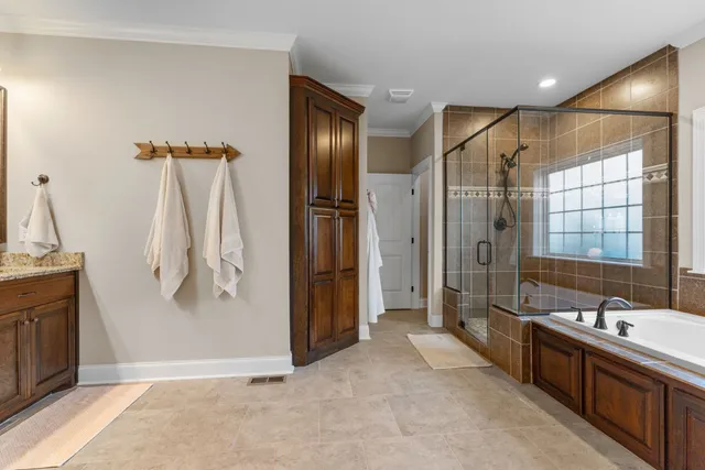 a view of a hallway with furniture and window