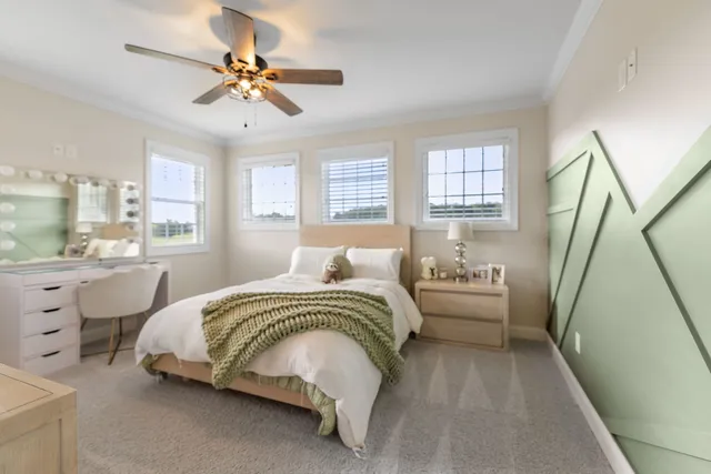 a spacious bedroom with a bed and a flat screen tv