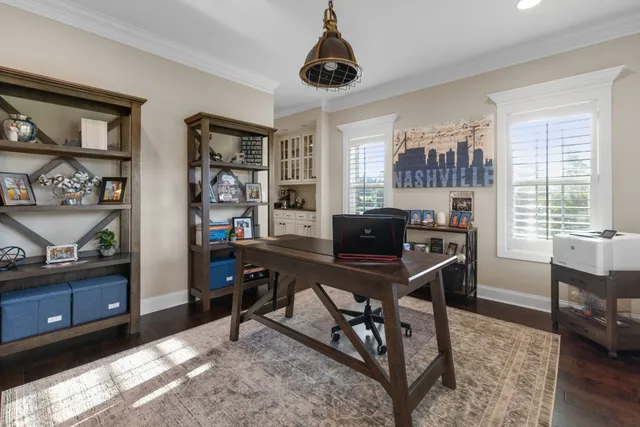 a kitchen with stainless steel appliances granite countertop a refrigerator oven a sink dishwasher and white cabinets next to a window