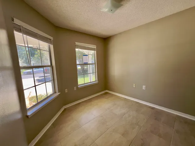 an empty room with closet area