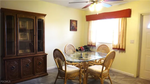 a dining room with furniture and window