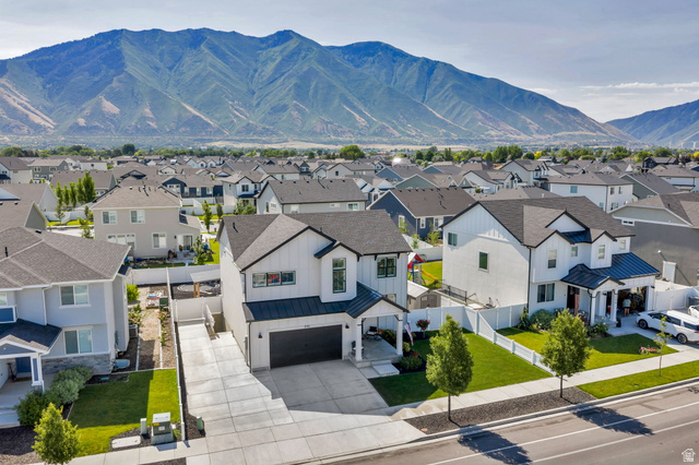 252 North Sunrise Rnch Drive Mapleton, UT 84664 - Photo 54 of 62 Modern two-story residence featuring a white exterior with black trim accents and a dark-shingled roof