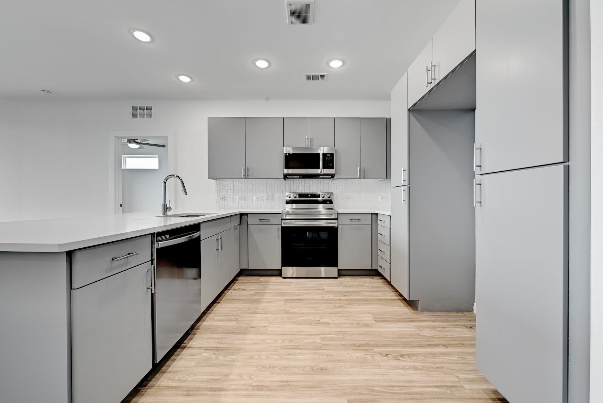 4801 Springdale Road, Unit 1301 Austin, TX 78723 - Photo 7 of 39 A well-appointed kitchen showcasing contemporary cabinetry, durable countertops, and sleek stainless steel appliances.