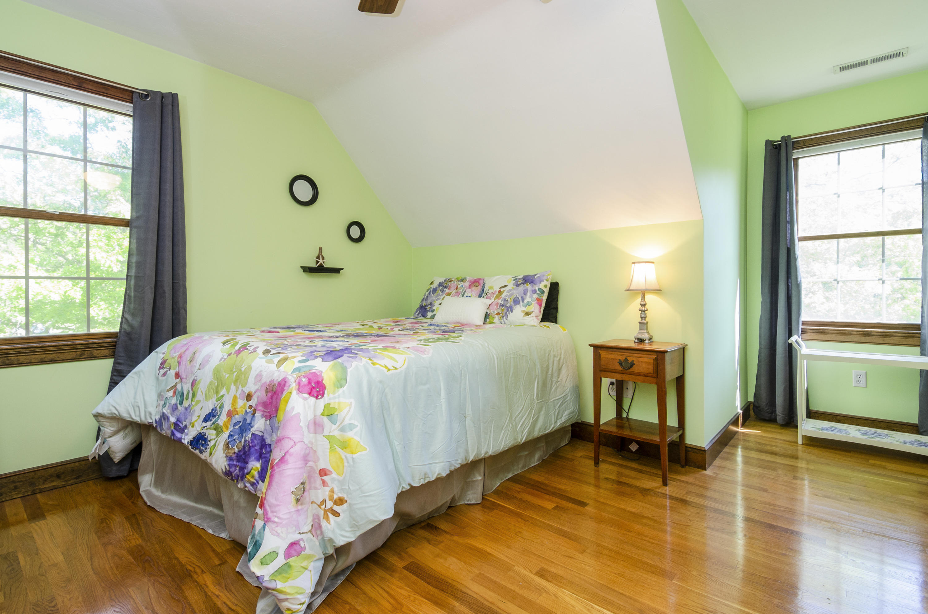 50 Waterhouse Road Bourne, MA 02532 - Photo 19 of 25 a bedroom with a bed and large windows