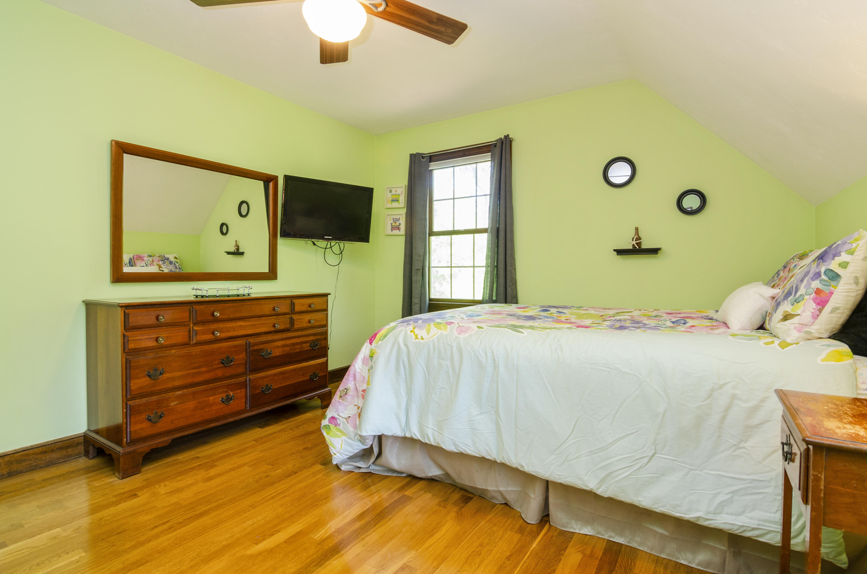 50 Waterhouse Road Bourne, MA 02532 - Photo 20 of 25 a bedroom with a bed and a window