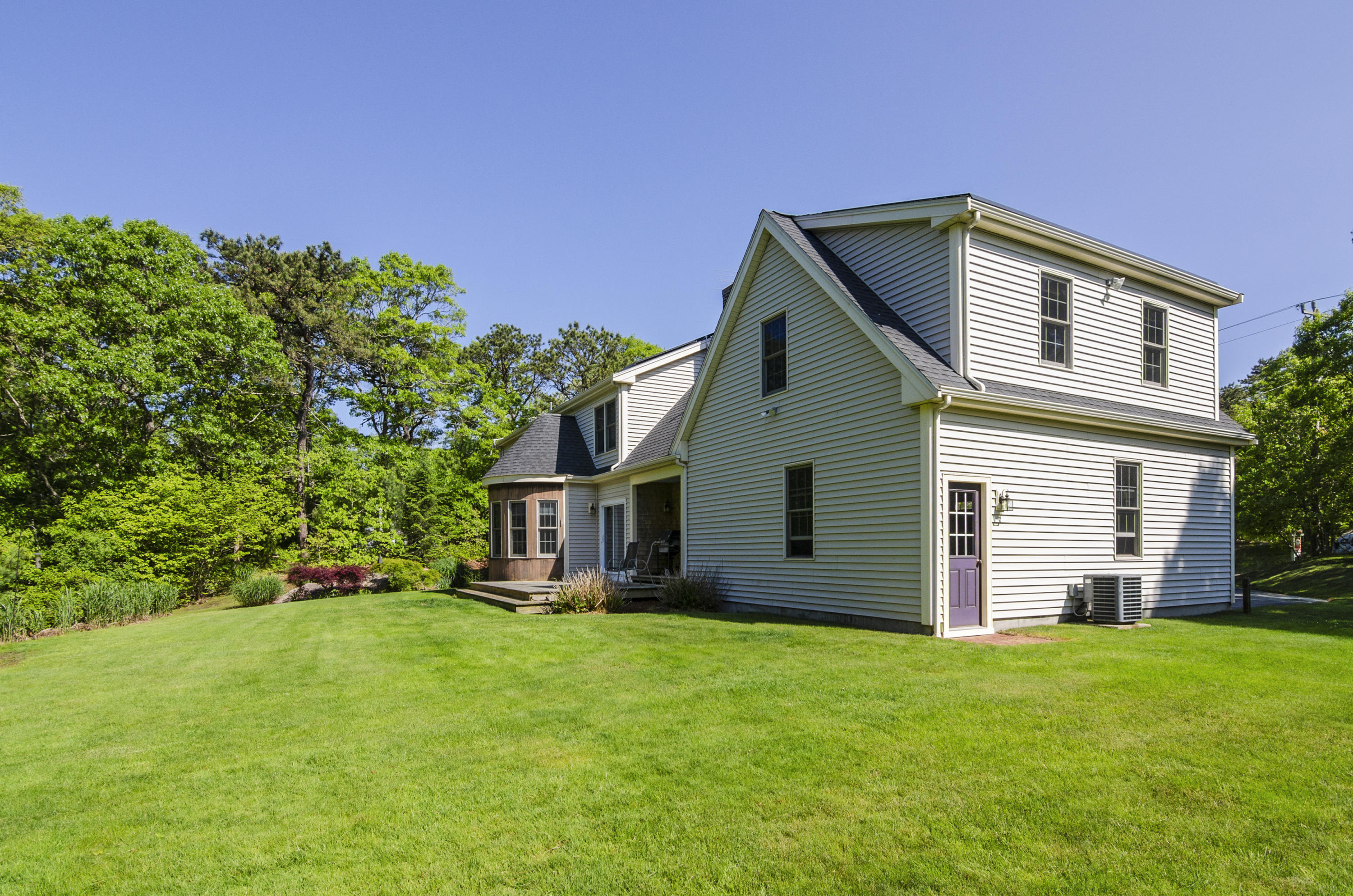 50 Waterhouse Road Bourne, MA 02532 - Photo 24 of 25 a view of a house with backyard and garden