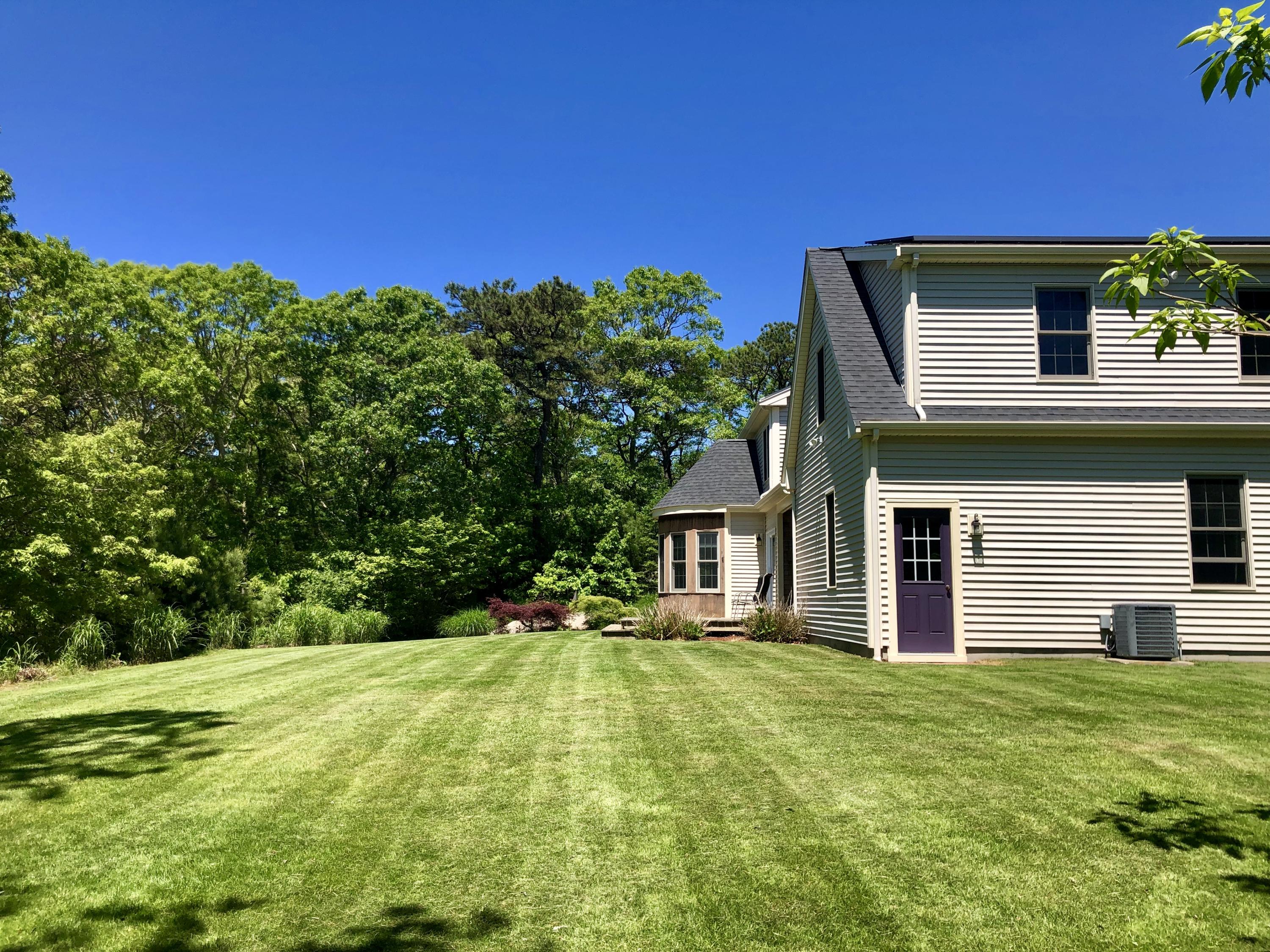 50 Waterhouse Road Bourne, MA 02532 - Photo 25 of 25 a front view of a house with a yard