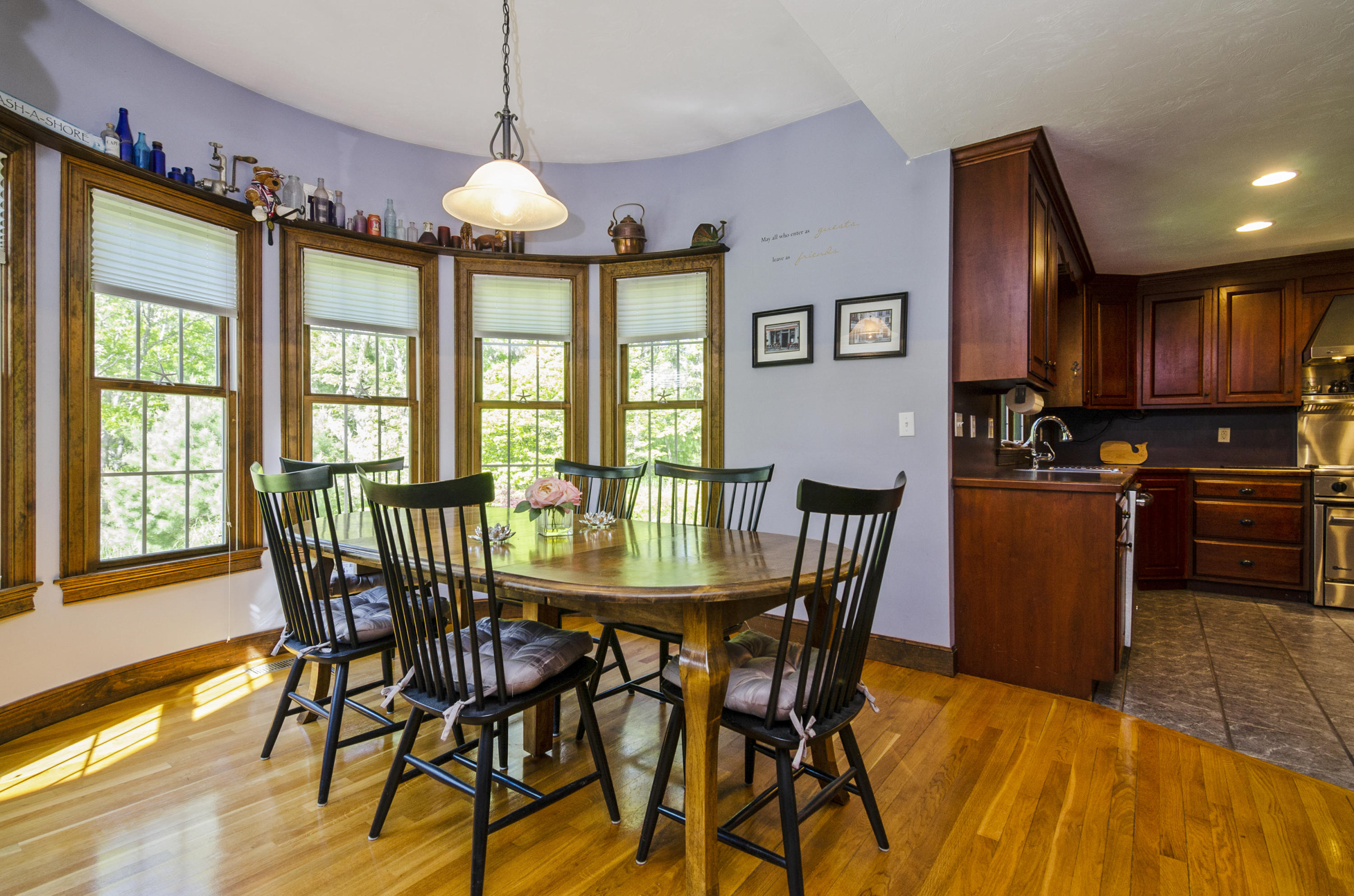50 Waterhouse Road Bourne, MA 02532 - Photo 7 of 25 a dining room with furniture a chandelier and wooden floor