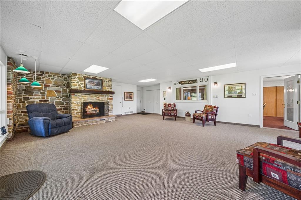 163 Banning Road Dawson, PA 15428 - Photo 16 of 50 Family Room with locally sourced stone fireplace and access to home office