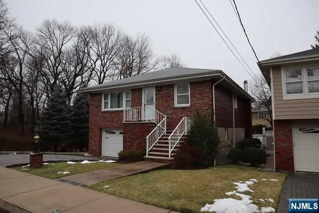 a front view of a house with garage