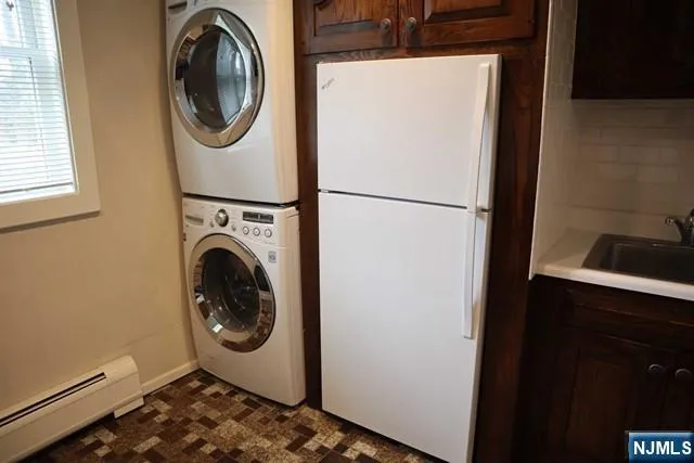 a utility room with dryer and washer